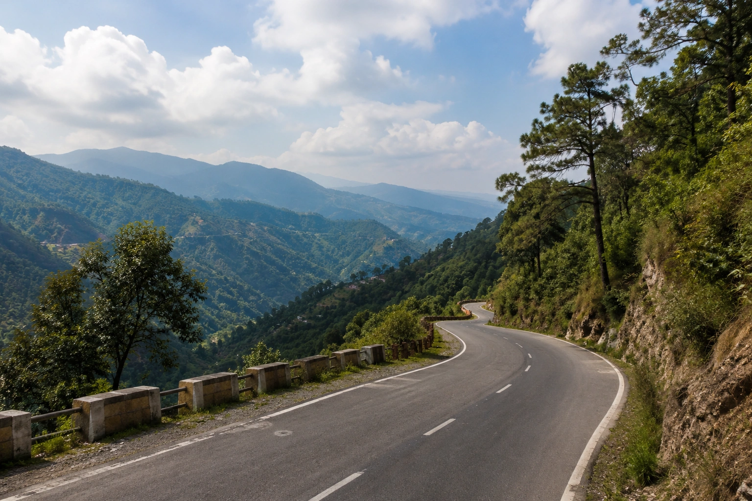 Scenic view of Old Mussoorie Road with green hills and mountain scenery