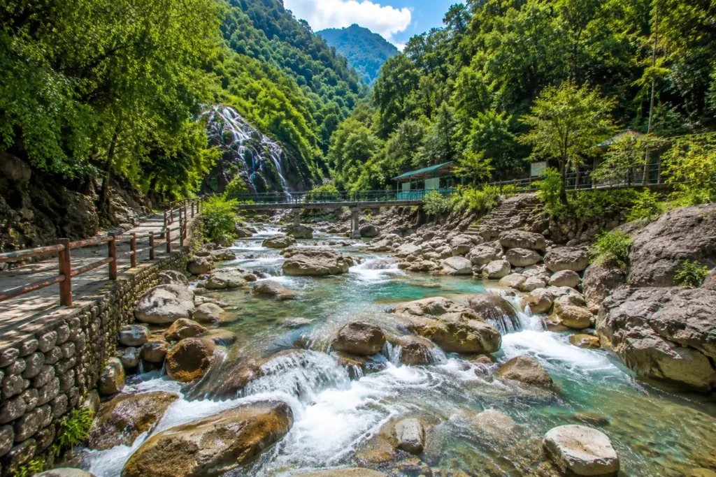 Sahastradhara Dehradun stream flowing through rocks with a waterfall in the background